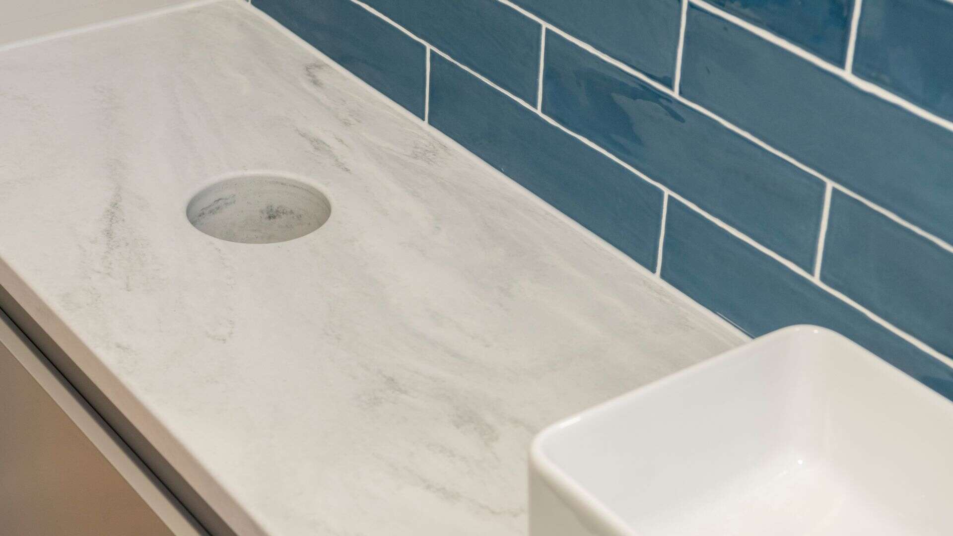 Solid Surface Vanity with Integrated Bin Chute