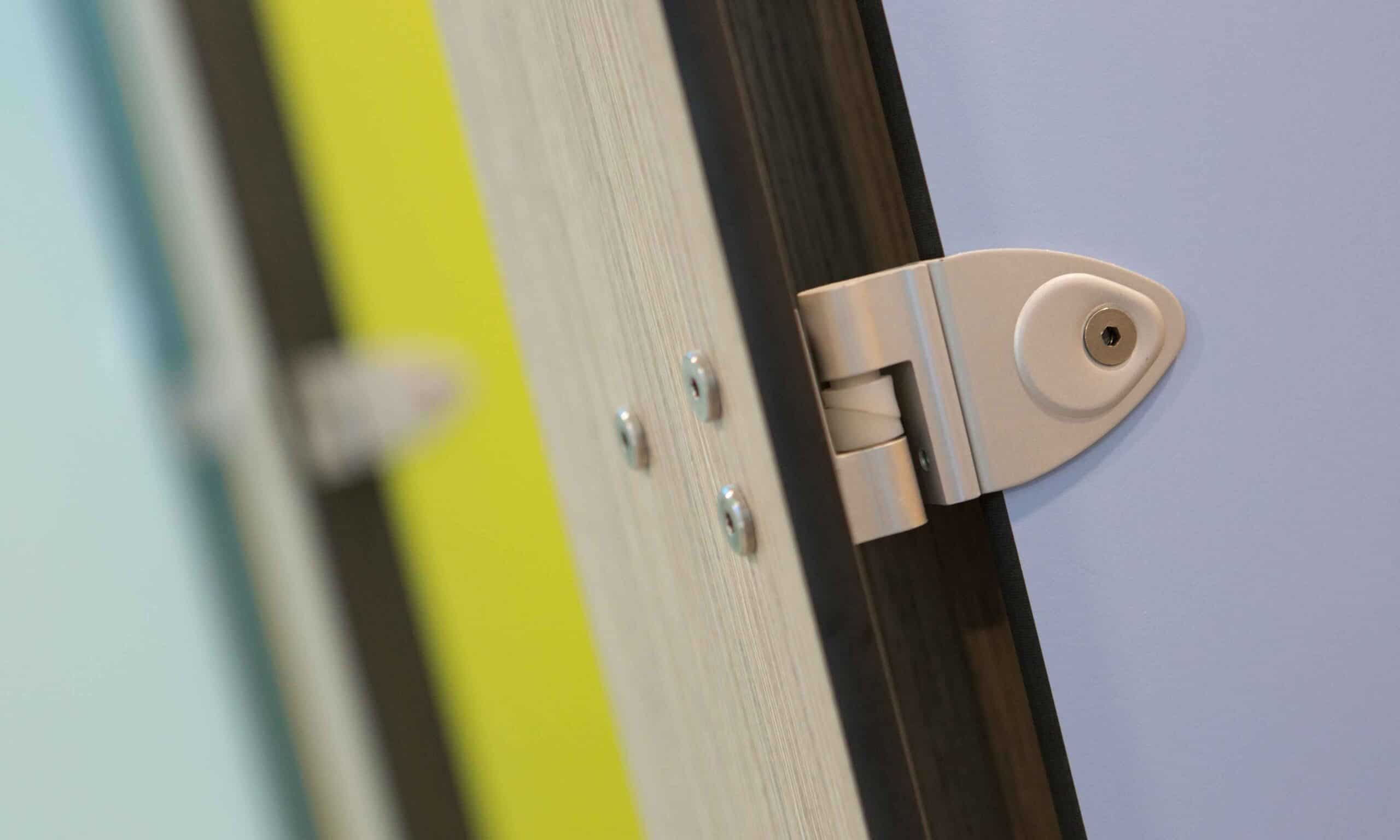 Up close image of a Force cubicle door hinge.