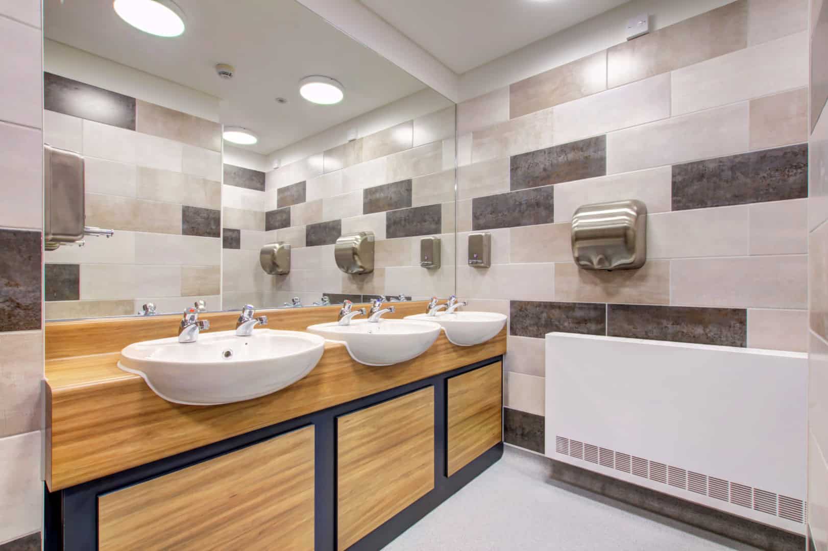 Laminate Vanity units inside a washroom.