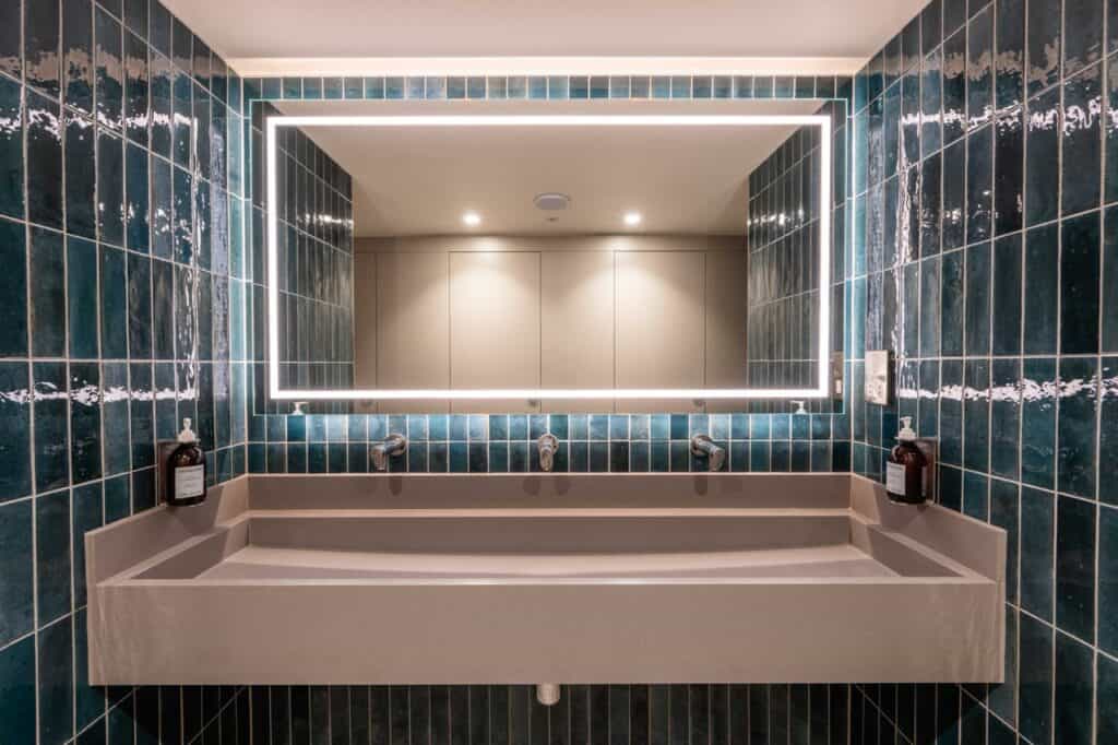 Solid surface wash trough in gym washroom area