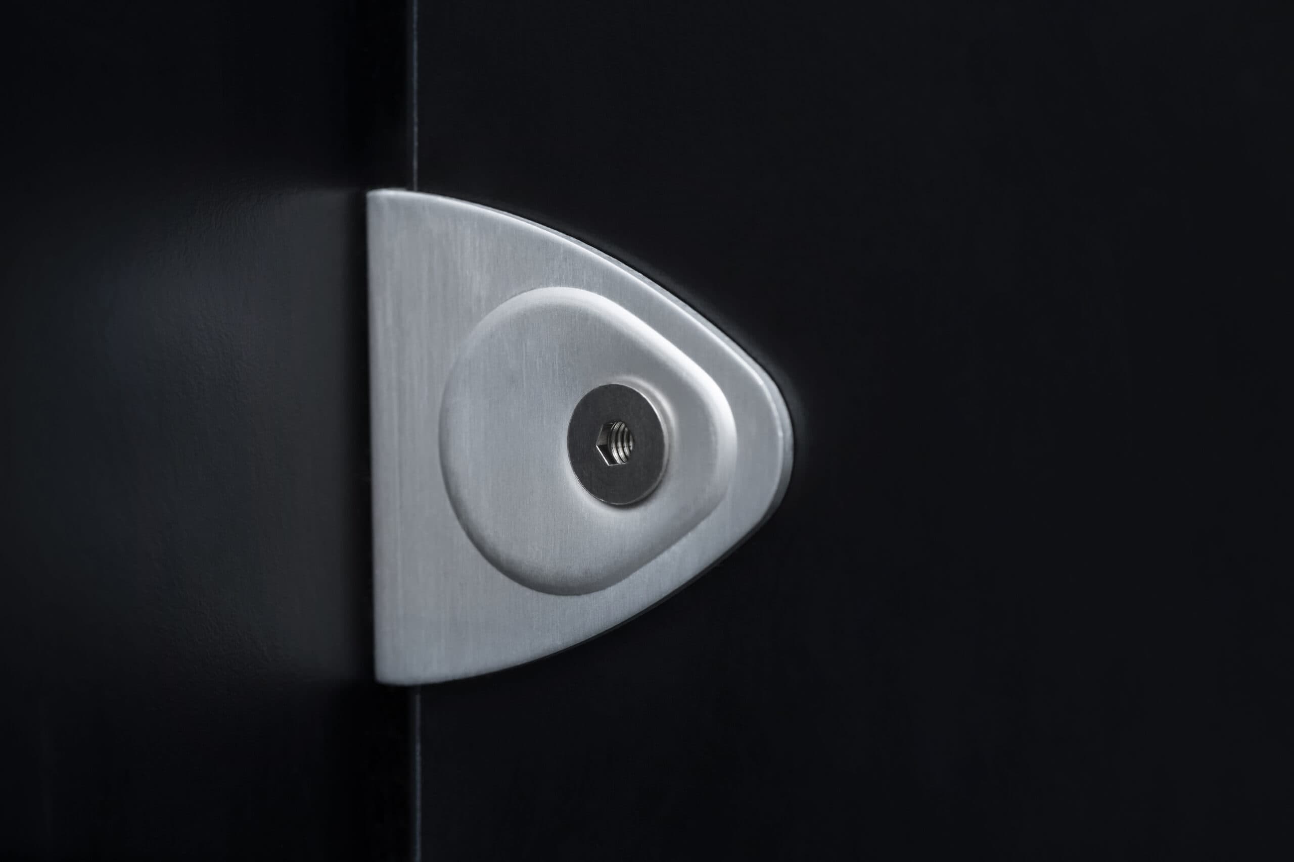 Mechanism in a washroom door, close-up view.