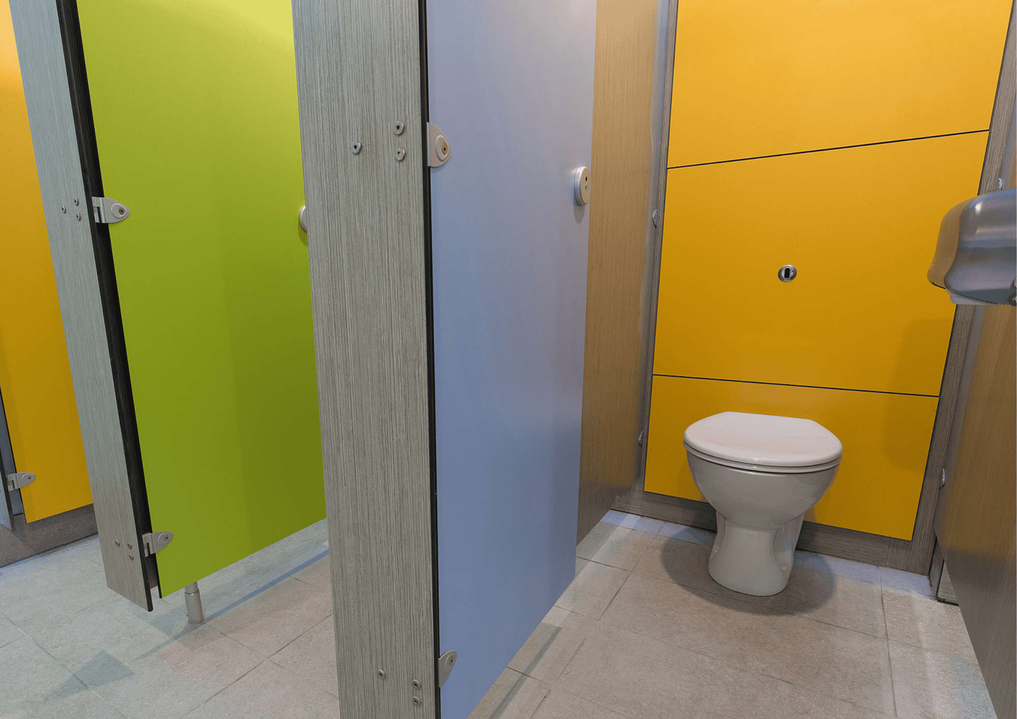Brightly coloured washroom cubicles with a toilet, part of the CGL Duct Panels concept.