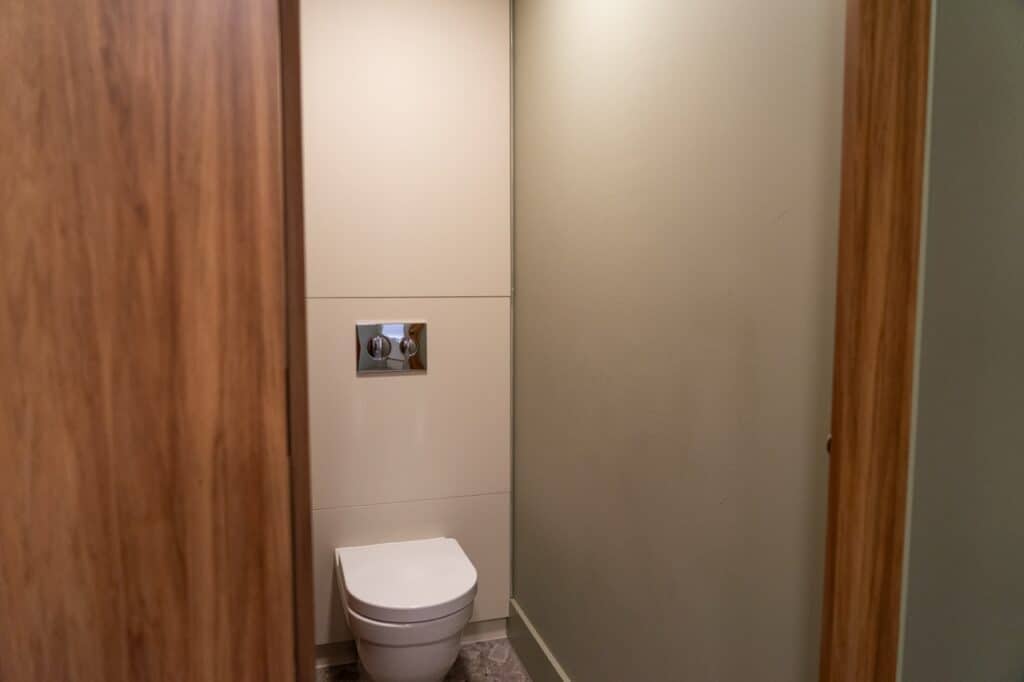 Compact washroom with modern fixtures and neutral colours.